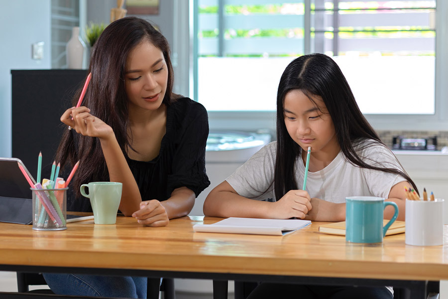 student and tutor together at a desk in Atlanta